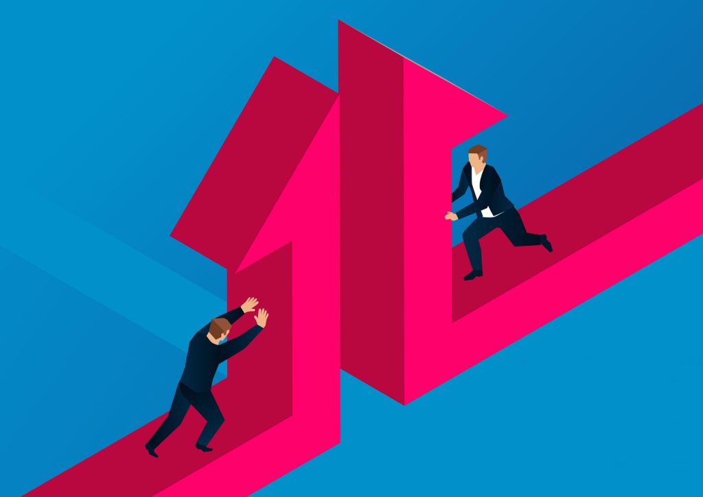 Cooperation and merger, two businessmen push the split arrow together